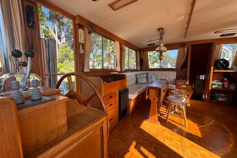 Good Enough Yacht Photos Pics Interior of a 1990 Grand Banks 46 Classic yacht with wooden furnishings and seating area.