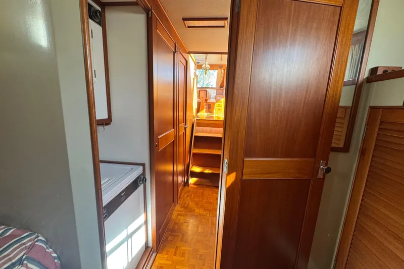 Good Enough Yacht Photos Pics Interior of 1990 Grand Banks 46 Classic yacht with wooden cabinetry and parquet flooring.