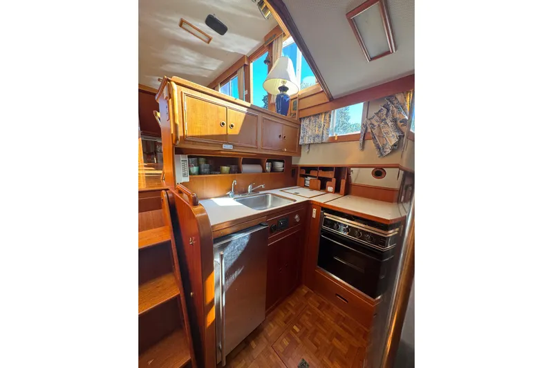 Good Enough Yacht Photos Pics Interior view of a 1990 Grand Banks 46 Classic yacht kitchen.