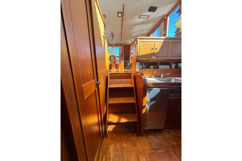 Good Enough Yacht Photos Pics Interior of 1990 Grand Banks 46 Classic yacht with wooden cabinetry and stairs.