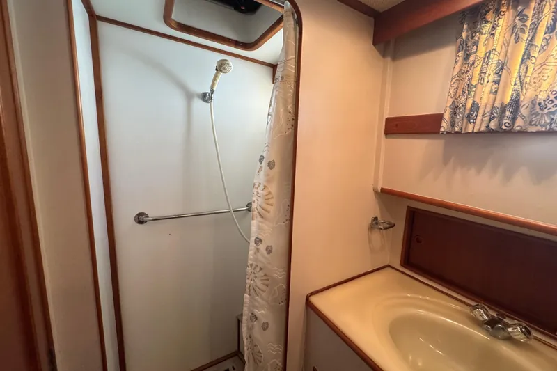 Good Enough Yacht Photos Pics Bathroom interior of 1990 Grand Banks 46 Classic yacht with shower and sink.