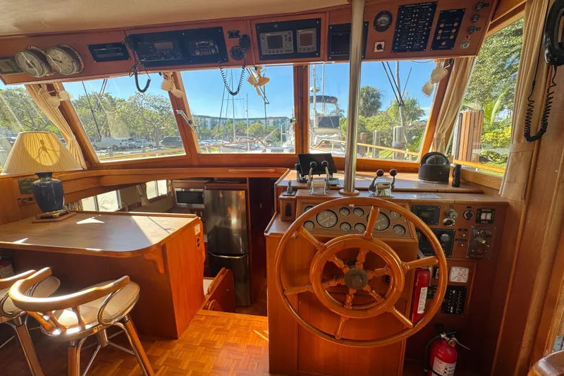 Good Enough Yacht Photos Pics Interior of 1990 Grand Banks 46 Classic yacht with wooden helm and navigation instruments.