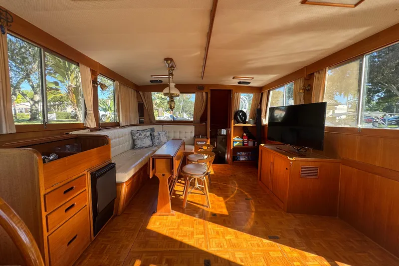 Good Enough Yacht Photos Pics Interior of 1990 Grand Banks 46 Classic yacht with wood furnishings and large windows.