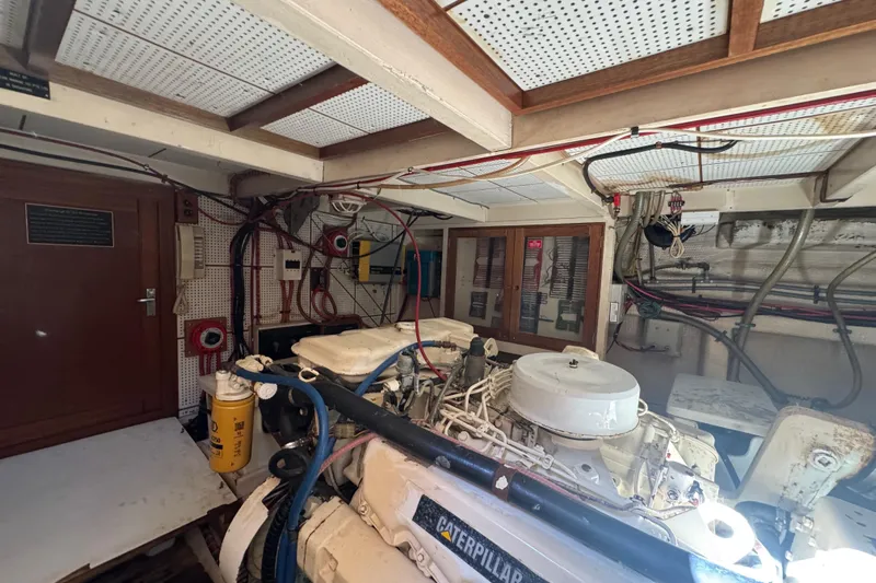 Good Enough Yacht Photos Pics Engine room of a 1990 Grand Banks 46 Classic yacht with visible machinery and wiring.