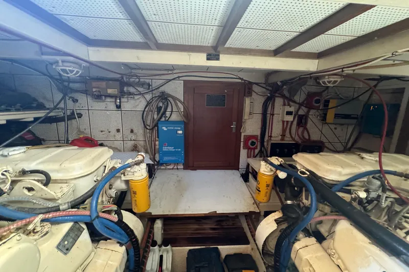 Good Enough Yacht Photos Pics Engine room of 1990 Grand Banks 46 Classic yacht, featuring dual engines and equipment.