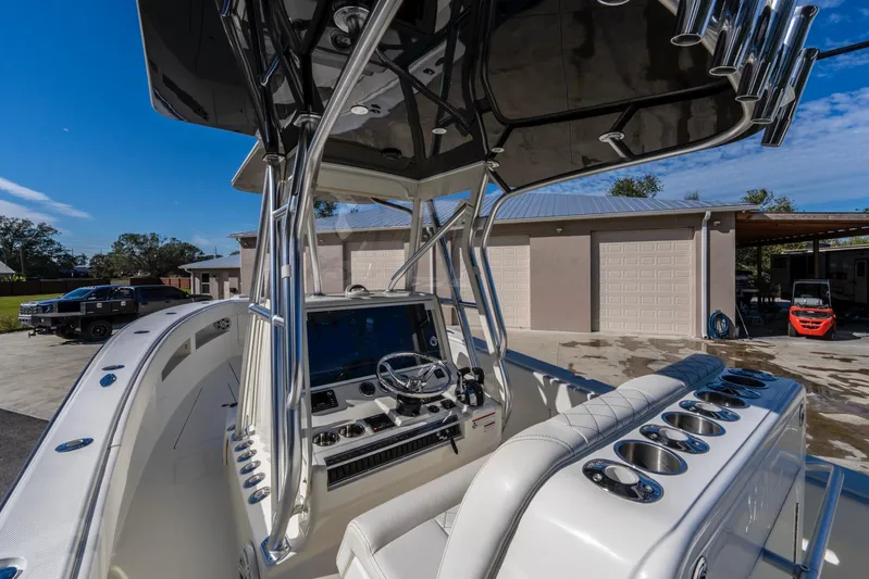 Pilar Yacht Photos Pics 2019 SeaVee 322z boat cockpit with steering wheel and control panel.