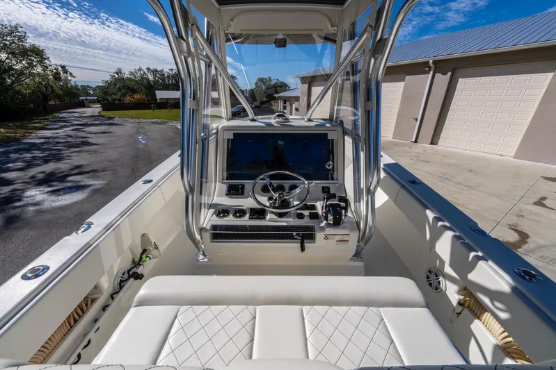 Pilar Yacht Photos Pics 2019 SeaVee 322z boat cockpit with steering wheel and controls.