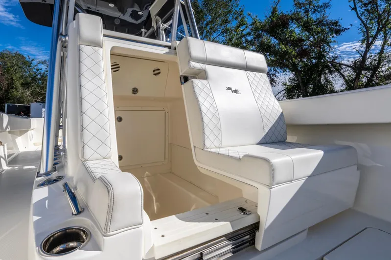 Pilar Yacht Photos Pics 2019 SeaVee 322z boat interior with white seating and storage compartment.