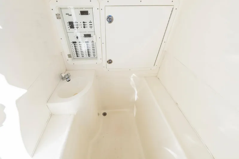 Pilar Yacht Photos Pics 2019 SeaVee 322z boat interior with control panel and storage compartment.