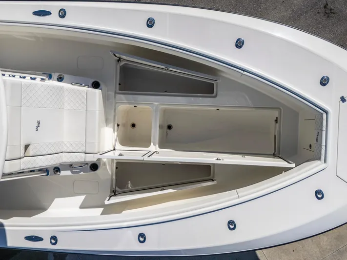 Pilar Yacht Photos Pics 2019 SeaVee 322z boat interior with open storage compartments and seating.