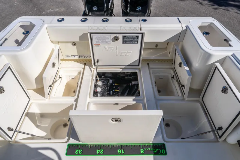 Pilar Yacht Photos Pics 2019 SeaVee 322z boat storage compartments and engine access, open for viewing.