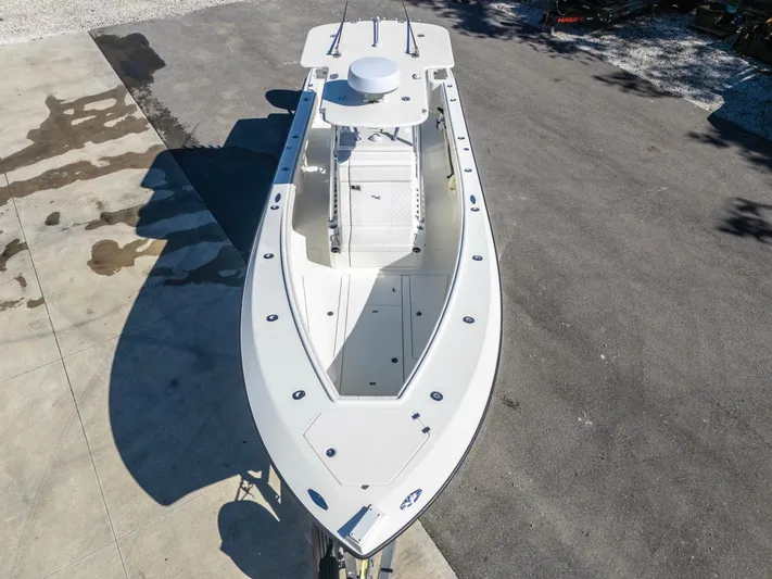 Pilar Yacht Photos Pics 2019 SeaVee 322z boat, aerial view, docked on concrete surface.
