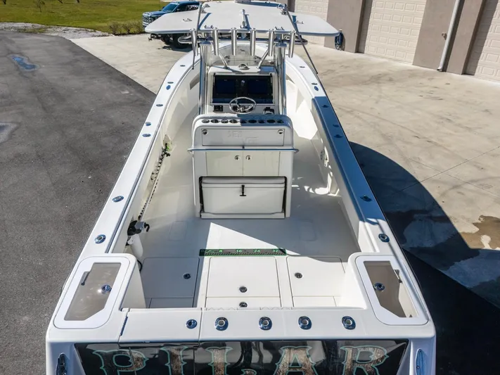 Pilar Yacht Photos Pics 2019 SeaVee 322z boat, aerial view, docked on concrete surface.