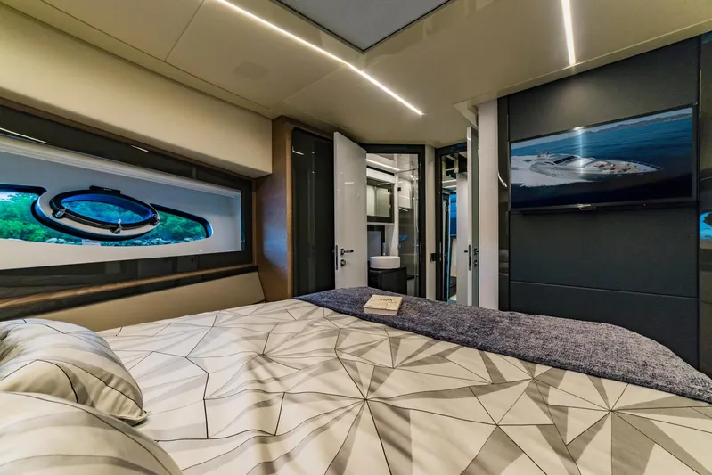 Bad Daddy Yacht Photos Pics Luxurious bedroom interior of 2018 Pershing 70 yacht with modern design and ocean view.