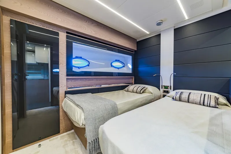 Bad Daddy Yacht Photos Pics Luxurious twin bedroom on a 2018 Pershing 70 yacht with modern decor.
