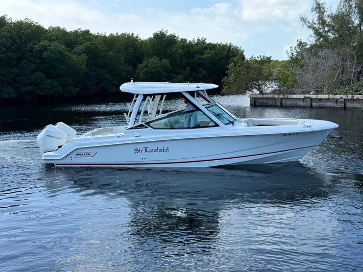  Yacht Photos Pics 2022 Boston Whaler 28 Vantage boat on calm water.