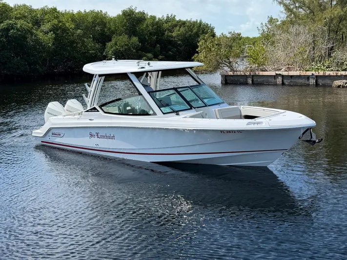  Yacht Photos Pics 2022 Boston Whaler 28 Vantage boat on calm water.
