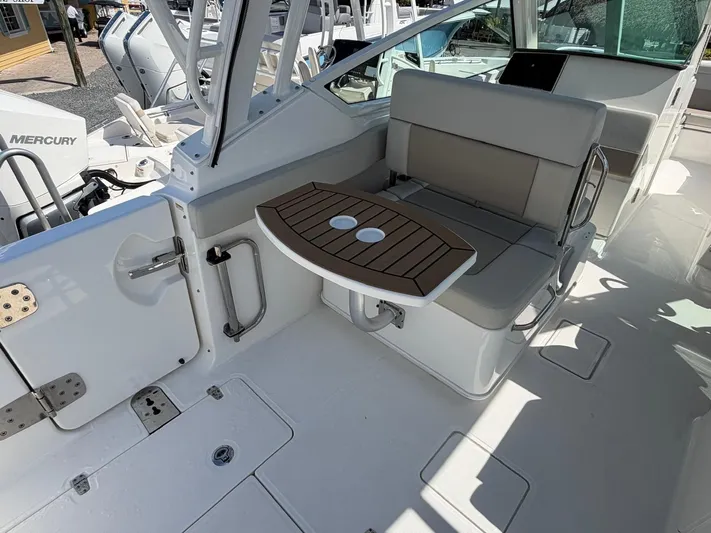  Yacht Photos Pics Interior of 2022 Boston Whaler 28 Vantage with seating and table.