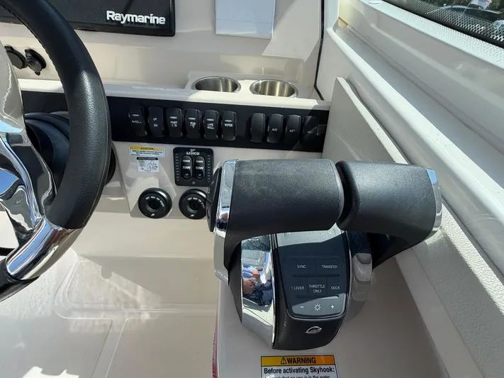  Yacht Photos Pics Boston Whaler 28 Vantage 2022 helm with controls and steering wheel.