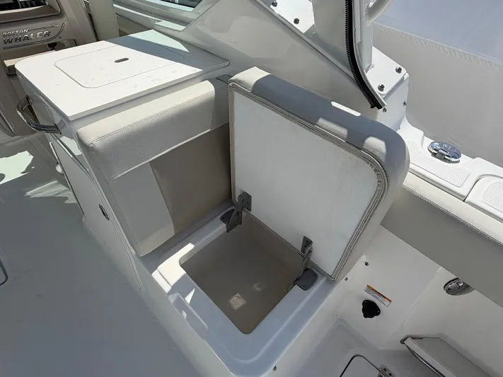  Yacht Photos Pics Boston Whaler 28 Vantage 2022, seat with storage compartment.