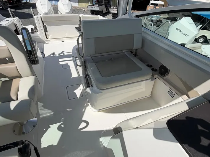  Yacht Photos Pics Interior of a 2022 Boston Whaler 28 Vantage boat with seating area.