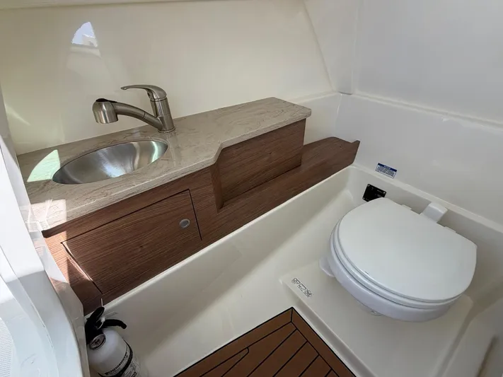  Yacht Photos Pics Interior of 2022 Boston Whaler 28 Vantage with sink and toilet.
