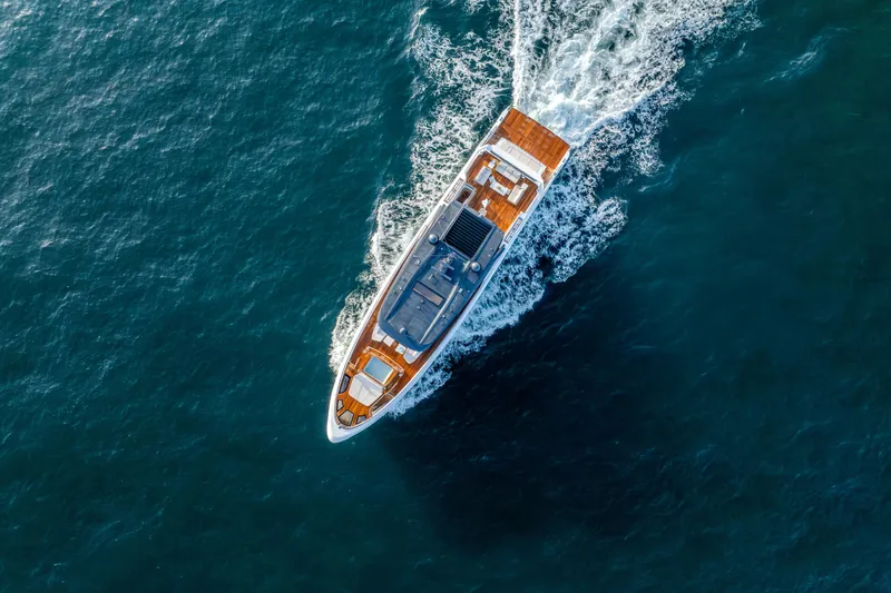  Yacht Photos Pics Aerial view of 2027 Majesty 100 Terrace yacht cruising on open water.