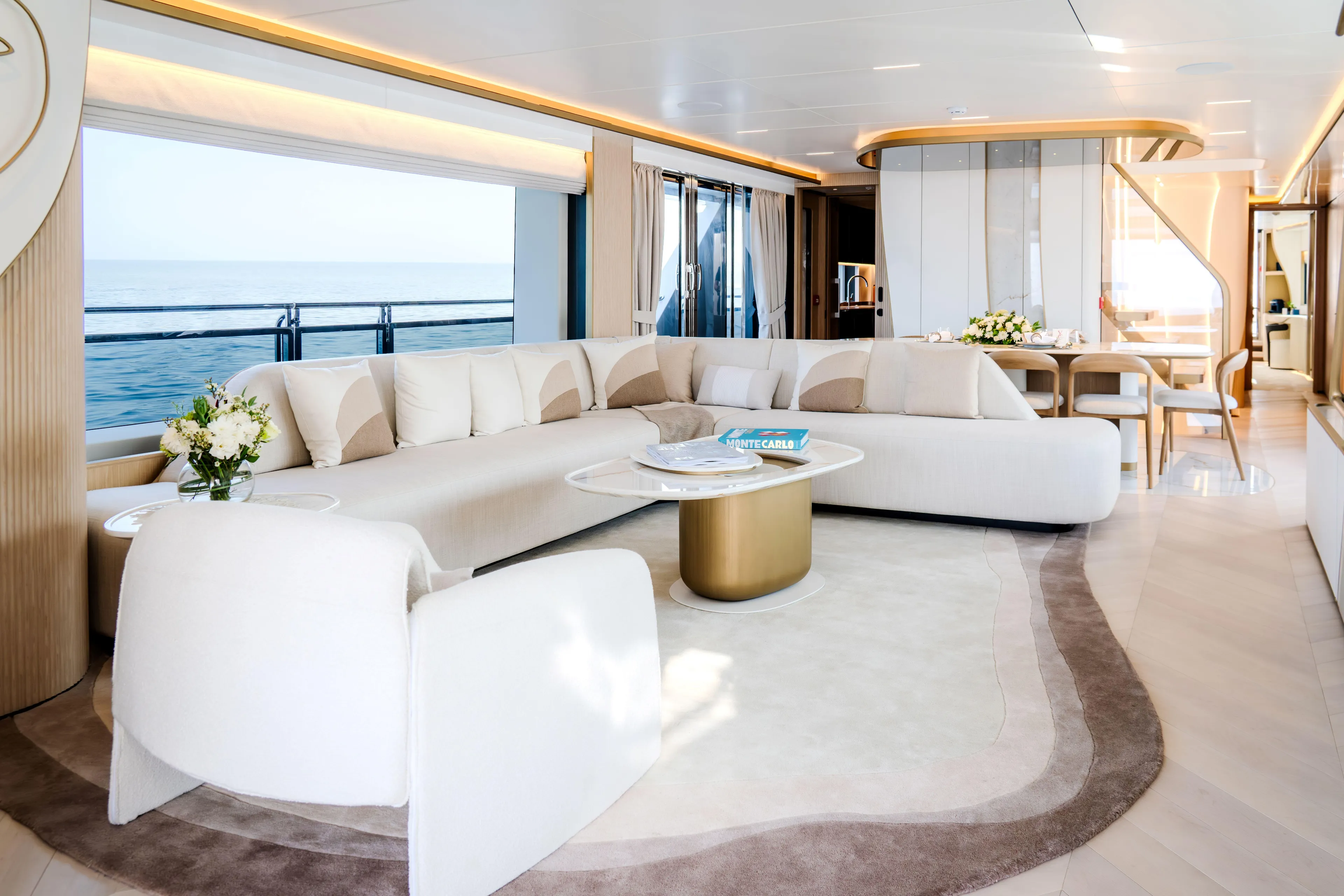  Yacht Photos Pics Luxurious interior of 2027 Majesty 100 Terrace yacht with elegant seating and ocean view.