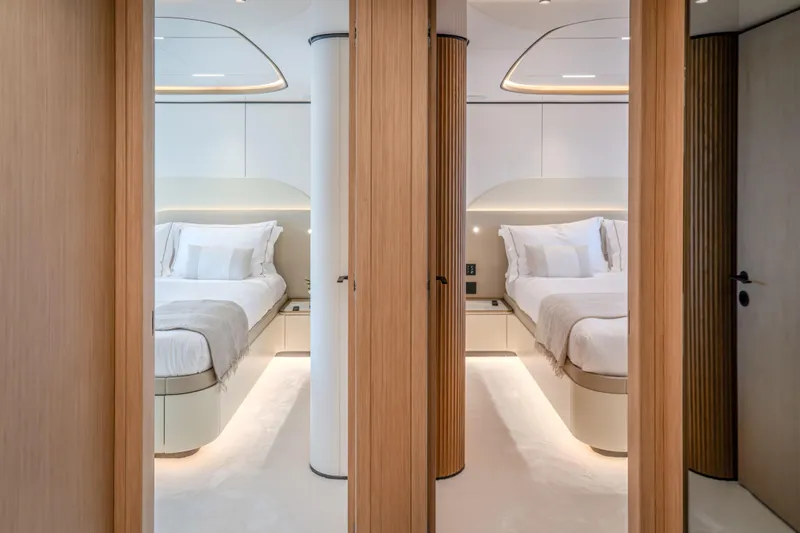  Yacht Photos Pics Luxurious bedroom interior on 2027 Majesty 100 Terrace yacht, featuring modern design and elegant lighting.