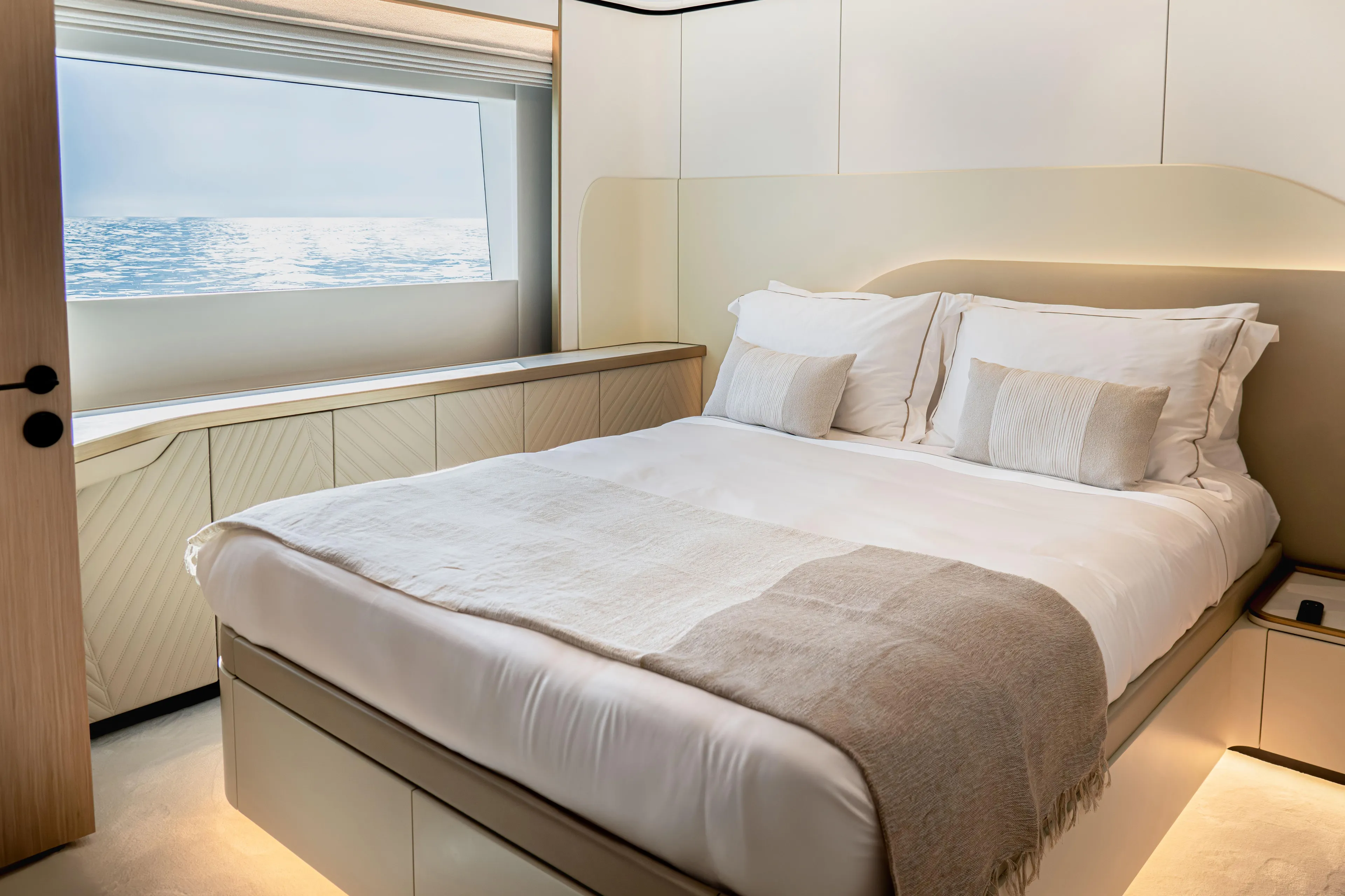  Yacht Photos Pics Luxurious bedroom on 2027 Majesty 100 Terrace yacht with ocean view.