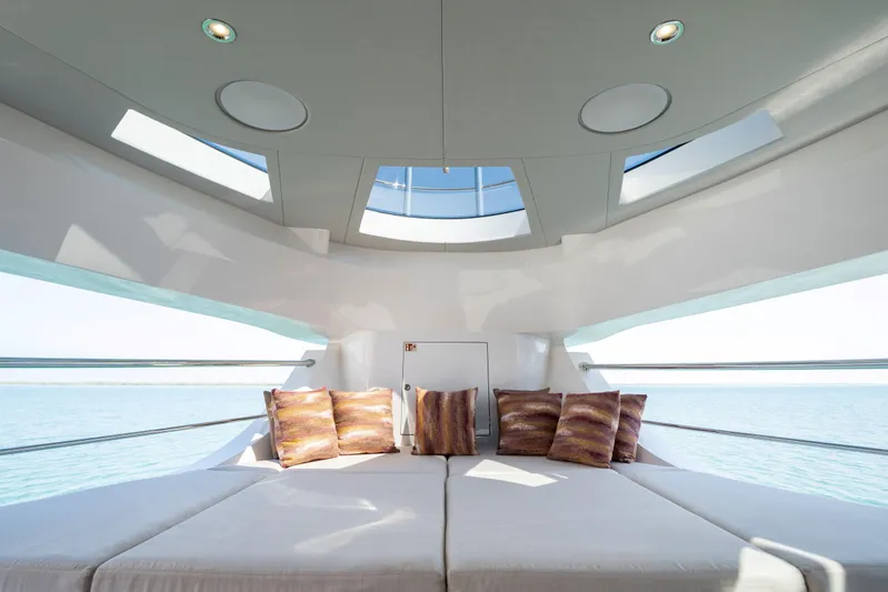  Yacht Photos Pics Luxurious interior of 2027 Majesty 100 Terrace yacht with panoramic windows and plush seating.