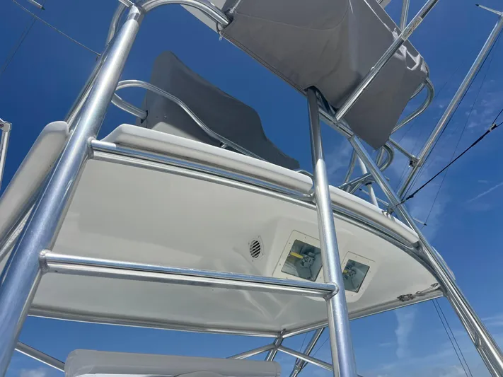  Yacht Photos Pics 2007 Topaz 32 Express boat tower against clear blue sky.
