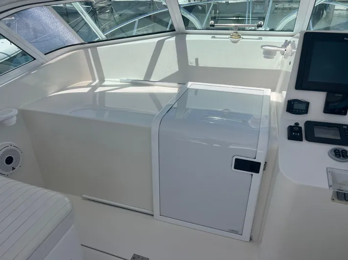  Yacht Photos Pics 2007 Topaz 32 Express boat interior with control panel and seating area.