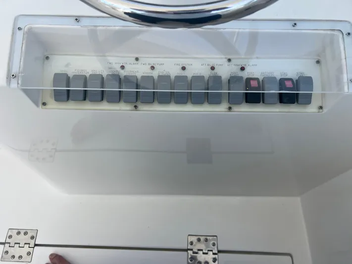  Yacht Photos Pics Control panel of a 2007 Topaz 32 Express boat with labeled switches.
