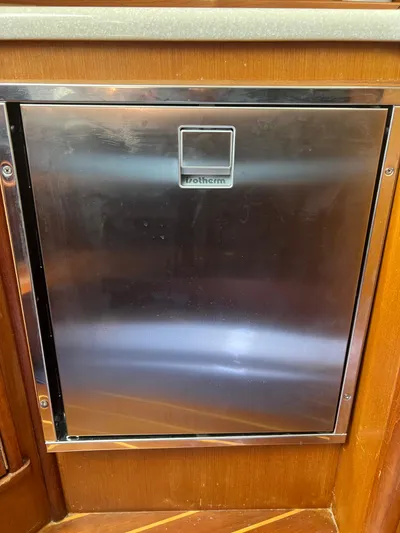  Yacht Photos Pics Stainless steel fridge door on 2007 Topaz 32 Express boat.