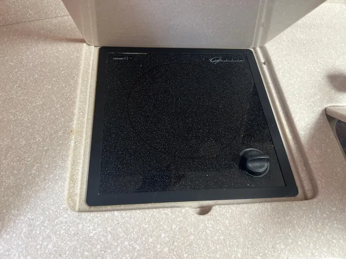  Yacht Photos Pics Ceramic cooktop on 2007 Topaz 32 Express boat, featuring a single control knob.