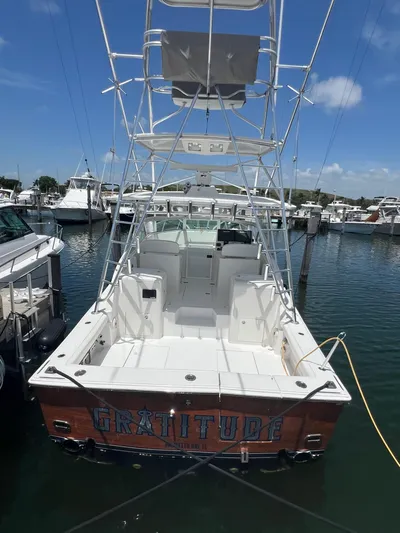  Yacht Photos Pics 2007 Topaz 32 Express boat docked in marina, clear sky, labeled "Gratitude."