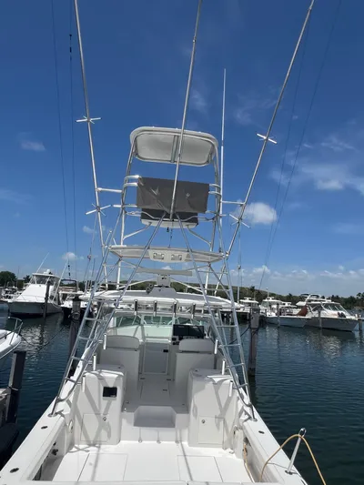  Yacht Photos Pics 2007 Topaz 32 Express boat docked at marina under clear blue sky.