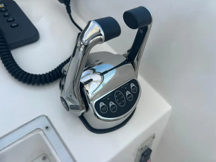  Yacht Photos Pics Chrome throttle controls on a 2007 Topaz 32 Express boat dashboard.