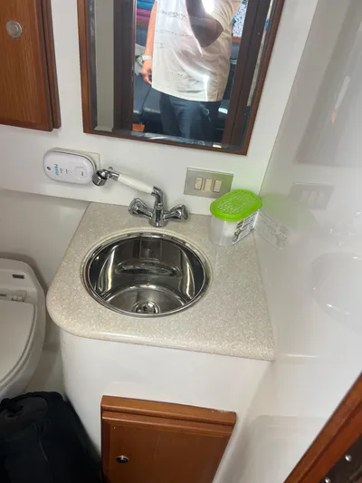  Yacht Photos Pics Compact bathroom sink area on a 2007 Topaz 32 Express boat.