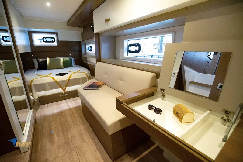 Ellidy Yacht Photos Pics Luxurious Bali 4.4 yacht interior, featuring a cozy bedroom and elegant vanity area, 2025 model.