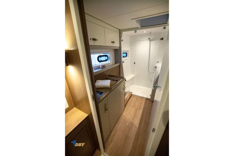 Ellidy Yacht Photos Pics Modern bathroom interior of 2025 Bali 4.4 yacht with shower and wooden accents.