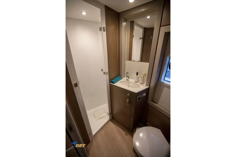 Ellidy Yacht Photos Pics Modern bathroom in 2025 Bali 4.4 yacht with shower, sink, and toilet.