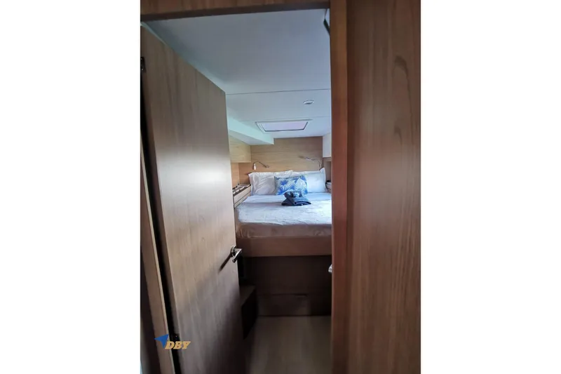 Ellidy Yacht Photos Pics Interior of 2025 Bali 4.4 yacht cabin with bed and wooden finish.