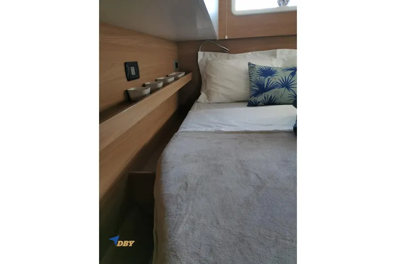 Ellidy Yacht Photos Pics Cozy cabin interior of 2025 Bali 4.4 yacht with modern bedding and wooden accents.