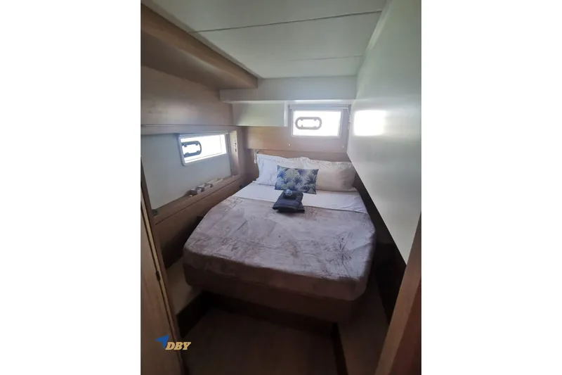 Ellidy Yacht Photos Pics Cozy bedroom in 2025 Bali 4.4 yacht with natural light and plush bedding.