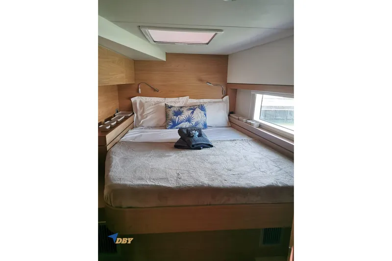 Ellidy Yacht Photos Pics Cozy bedroom in 2025 Bali 4.4 yacht with skylight and modern decor.