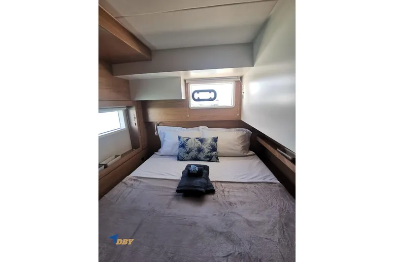 Ellidy Yacht Photos Pics Cozy cabin interior of 2025 Bali 4.4 yacht with bed and window.