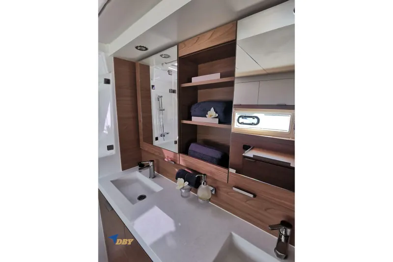 Ellidy Yacht Photos Pics Modern bathroom interior of 2025 Bali 4.4 yacht with dual sinks and wooden cabinetry.
