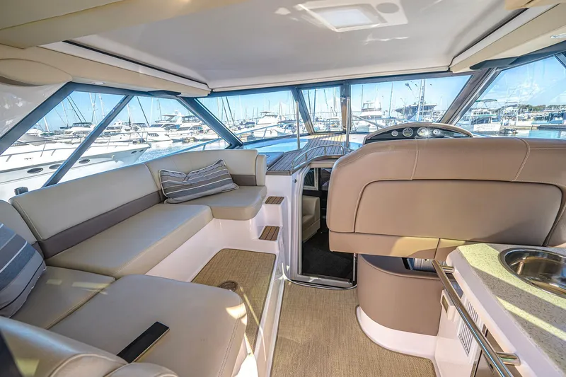  Yacht Photos Pics Luxurious interior of 2016 Regal 46 Sport Coupe yacht with marina view.